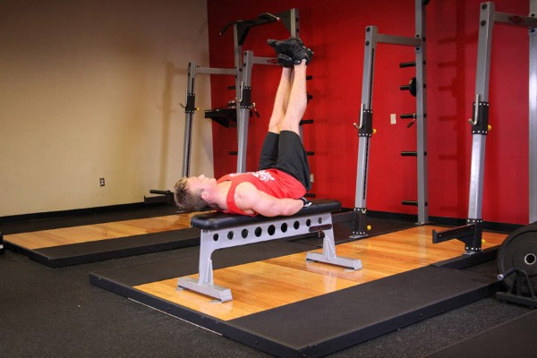 Flat bench lying leg raise